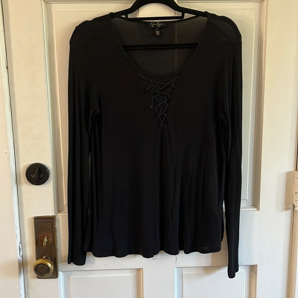 Black top with lace detail.